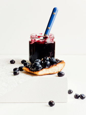 White bread toast with blueberry jam. Shallow dof.