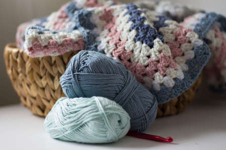 blue woolen balls with crochet hookの写真素材