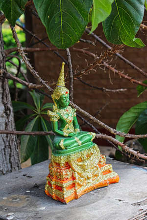 thailand travel religious temple background golden green figure buddah colorfulの写真素材