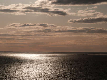beautiful sunset above the baltic sea with cloudy skyの写真素材