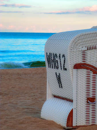 white beach chair on beach at baltic sea in germanyの写真素材