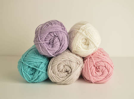 pastel colored woolen balls for crocheting and handicraft