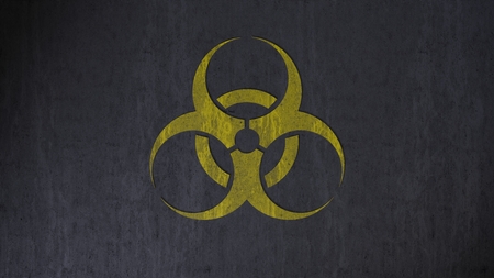 Dirty biohazard warning sign on concreteの写真素材