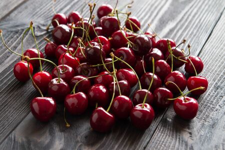 fresh sweet cherry on wooden backgroundの写真素材