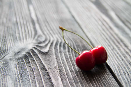 fresh sweet cherry on wooden background