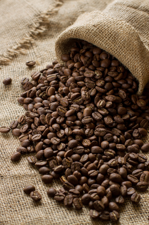 large coffee beans on sackclothの写真素材