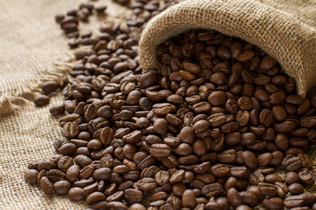 large coffee beans on sackclothの写真素材