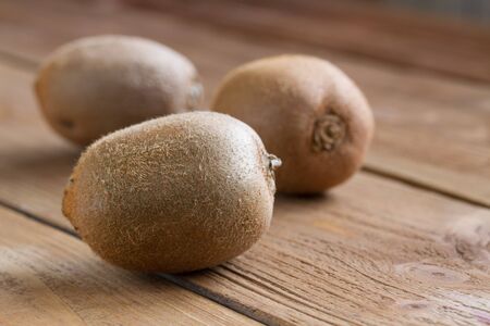 kiwi on a wooden background. close-upの写真素材