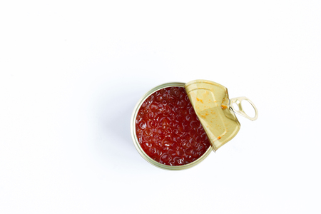 Red caviar in a metal pot on a white background , top viewの写真素材