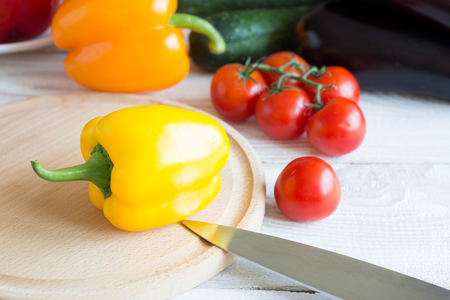 Fresh vegetables, ingredients for cooking a healthy lunch. Sweet peppers, tomatoes, cucumbers, eggplantの写真素材