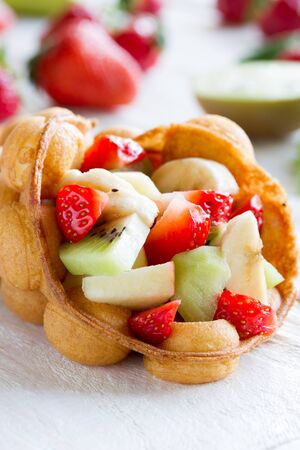 waffles with fruits, strawberries, apple and kiwiの写真素材