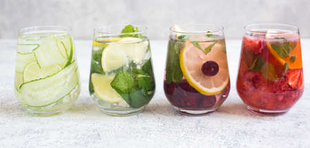 Different types of lemonade, classic, strawberry and cucumber. Summer refreshing drinks