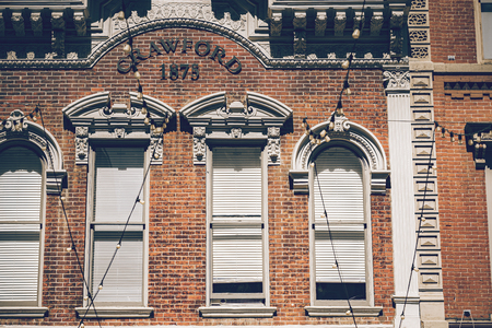 Beautiful historic building with old large windows, outdoor lights in a historic place of Denver city.のeditorial素材