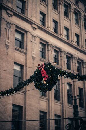 New Year's Eve snowing day in the city. Showing in the streets of Downtown. Snowy city streets