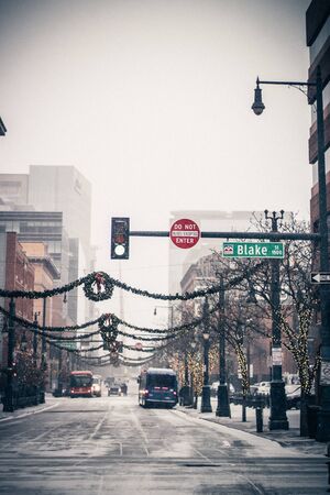 New Year's Eve snowing day in the city. Showing in the streets of Downtown. Snowy city streetsの写真素材