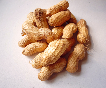 Raw Groundnut on white background