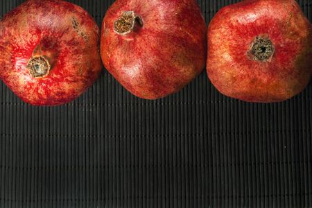 red pomegranate on a black backgroundの写真素材