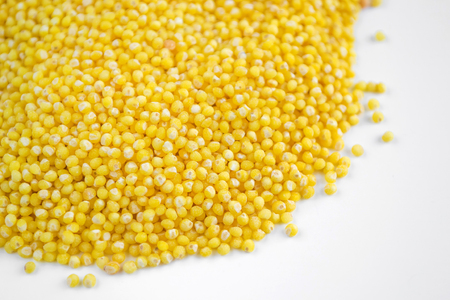 Millet grits on a white background
