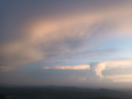 Cloudscape, Colored Clouds at Sunset near the Ocean, in the Background