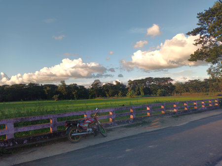 Road in the countryside of Thailand. The road is under the sky with clouds.の写真素材