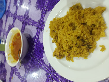 Thai food, rice with curry in white plate on table.の写真素材