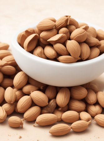 almonds in a white bowl on a brown background close-upの素材