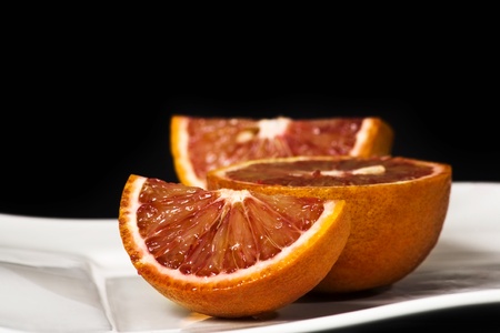 orange slice shot in the studio isolated on black.