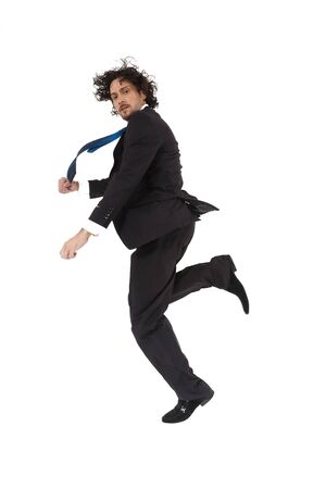 young active businessman jumping and rushing to the office in hurry.の写真素材