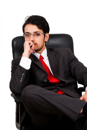 portrait of a worried businessman sitting on office chairの写真素材