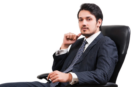 portrait of a confident Arab businessman sitting on a chair, biracial businessman isolated on whiteの写真素材