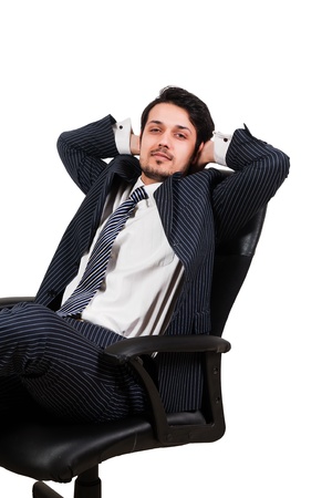 portrait of a confident Arab businessman sitting on a chair, biracial businessman isolated on whiteの写真素材