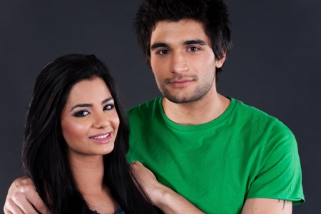 portrait of ethnic couple couple in studio, latin american man with Indian girlの写真素材