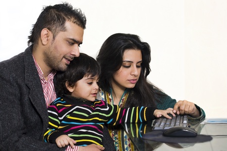 happy multi ethnic family of three enjoying togetherの写真素材