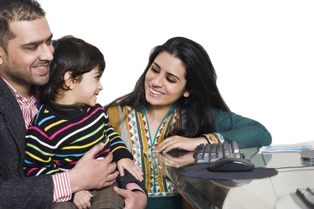 happy multi ethnic family of three enjoying togetherの写真素材