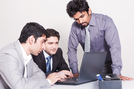 small group of young multiracial businessmen in office meetingの写真素材