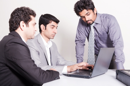 small group of young multiracial businessmen in office meetingの写真素材