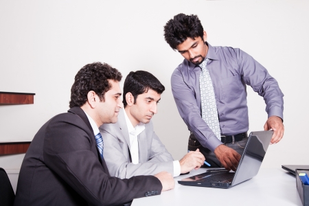 small group of young multiracial businessmen in office meetingの写真素材