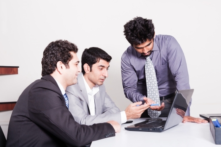 small group of young multiracial businessmen in office meetingの写真素材