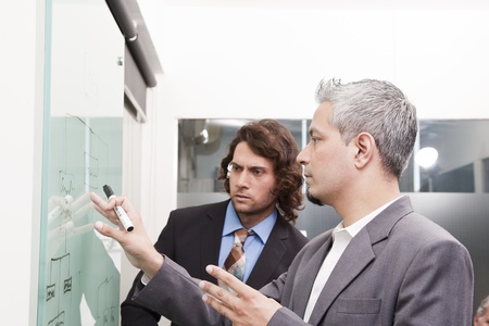 young businessman giving presentation to his colleaguesの写真素材