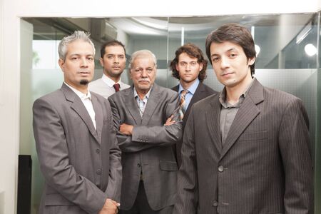 Group of businessmen in office, senior businessman with his colleaguesの写真素材