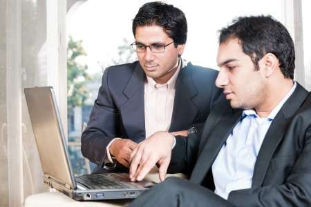 two Indian businessmen in meeting, two businessmen working on the laptopの写真素材