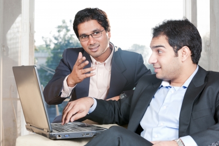 two Indian businessmen in meeting, two businessmen working on the laptopの写真素材