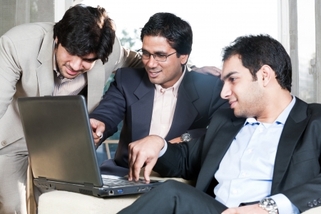 group of multi ethnic businessmen, indian businessman in a meeting with his colleaguesの写真素材