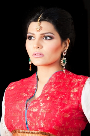 portrait of a beautiful muslim bride in red dressの写真素材