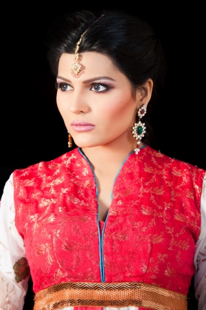 portrait of a beautiful muslim bride in red dressの写真素材
