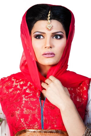 portrait of a beautiful muslim bride in red dressの写真素材