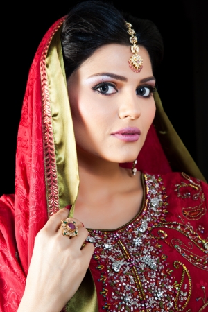 Muslim Indian bride wearing a red bridal dress, portrait of a beautiful Indian brideの写真素材