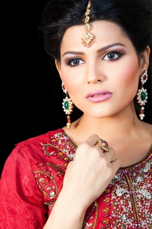 Muslim Indian bride wearing a red bridal dress, portrait of a beautiful Indian brideの写真素材