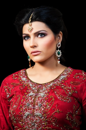 Muslim Indian bride wearing a red bridal dress, portrait of a beautiful Indian brideの写真素材