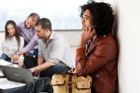 portrait of a university student with his friends in the background, group of multiethnic studentsの写真素材